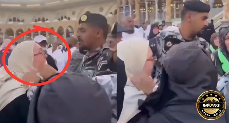 Kəbə örtüyünü qayçı ilə kəsmək istəyən türk saxlanıldı - VİDEO